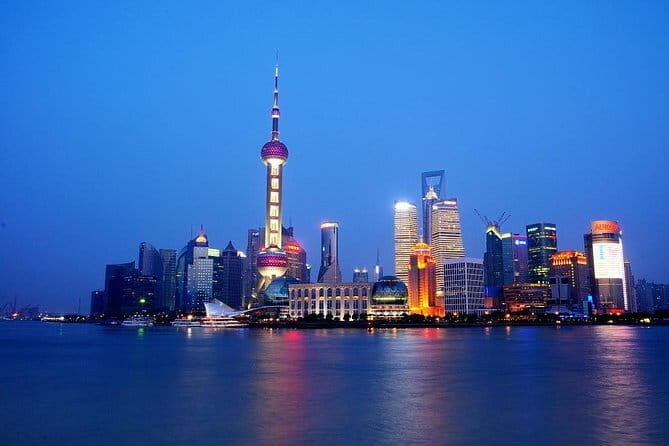 Shanghai by Night with Fine Local Dinner and VIP River Cruise Experiences - Dinner in a local restaurant, with soft drinks and real ordering help